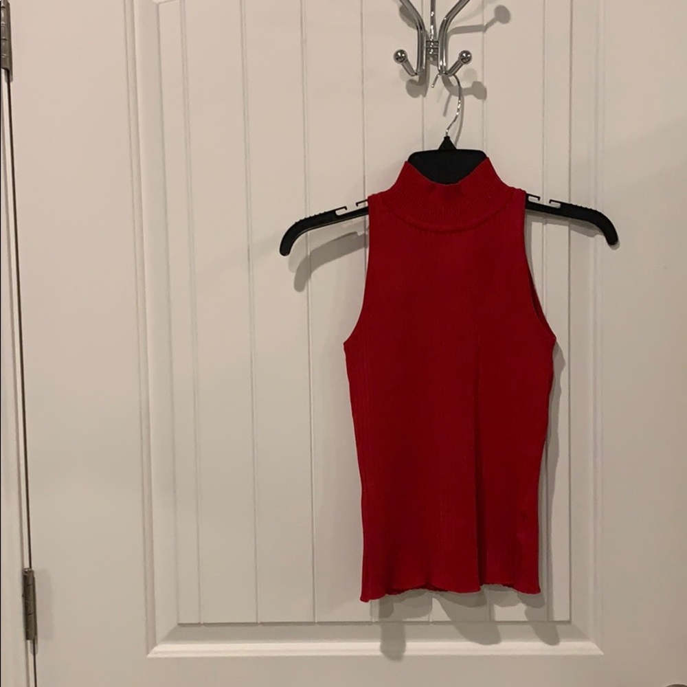 Red sleeveless sweater with back zipper top.